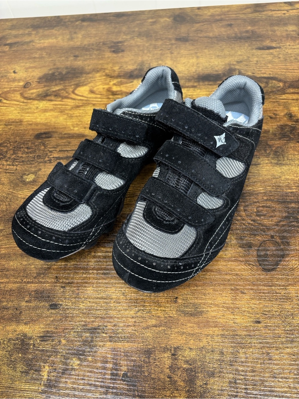 Women’s Black and Gray specialized Cycling cleats.